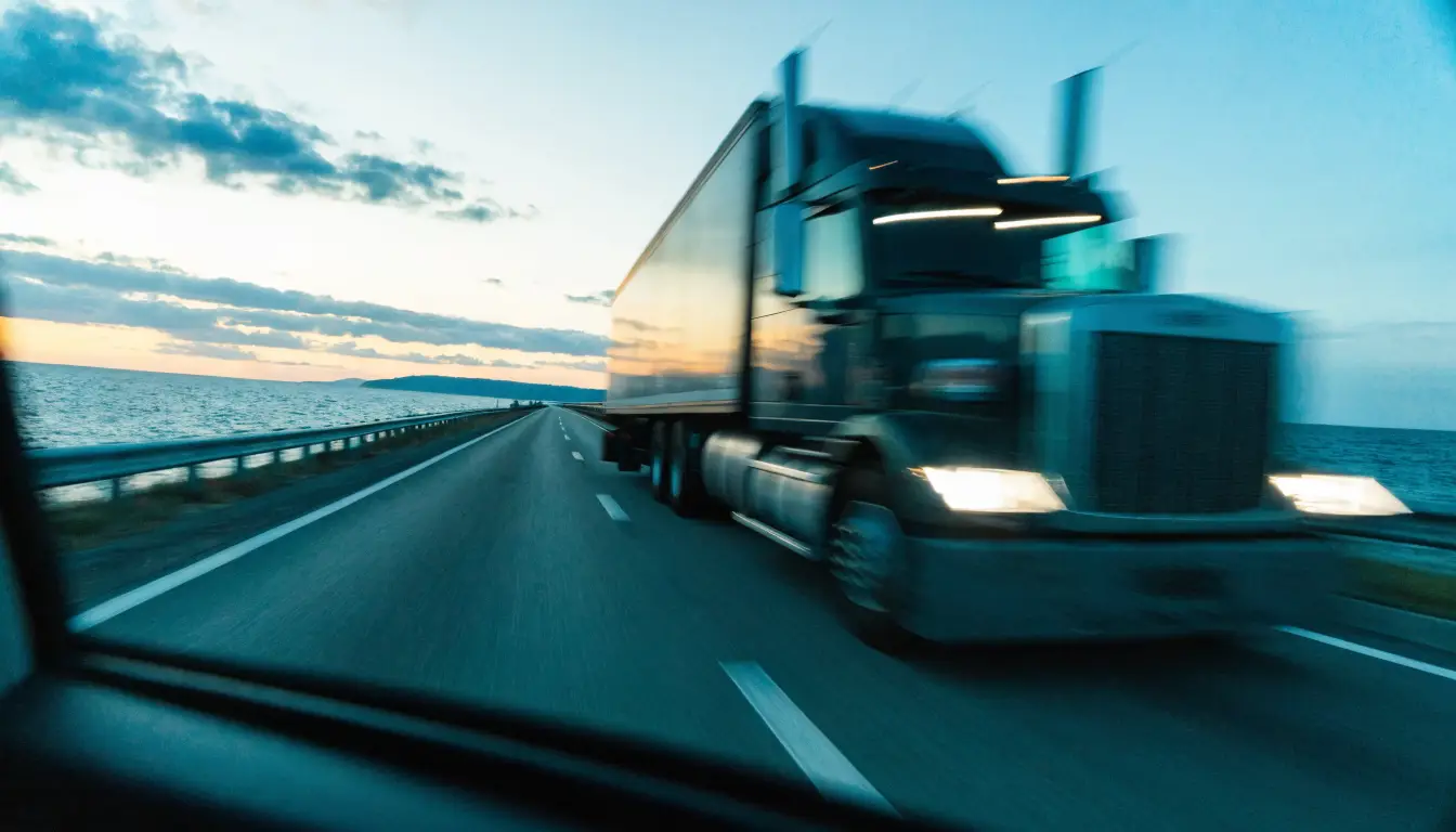 A semi truck looming in a side mirror on the I-5 near Oceanside — where truck claims begin